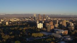 5.7K aerial stock footage of skyscrapers at sunrise, seen from apartment buildings, Downtown Denver, Colorado Aerial Stock Footage | DX0001_001409