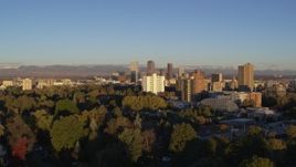 5.7K aerial stock footage ascend near apartment buildings for view of skyscrapers in Downtown Denver, Colorado at sunrise Aerial Stock Footage | DX0001_001410