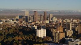 5.7K aerial stock footage of a reverse view of skyscrapers in Downtown Denver, Colorado at sunrise Aerial Stock Footage | DX0001_001412
