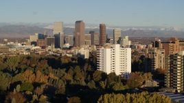 5.7K aerial stock footage descend near apartment building with view of skyscrapers in Downtown Denver, Colorado at sunrise Aerial Stock Footage | DX0001_001421