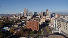 5.7K aerial stock footage ascend from apartment building to reveal skyscrapers in Downtown Denver, Colorado Aerial Stock Footage | DX0001_001422