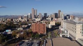 5.7K aerial stock footage of the city's skyscrapers, descend near apartment building in Downtown Denver, Colorado Aerial Stock Footage | DX0001_001432