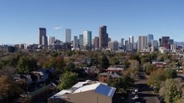 5.7K aerial stock footage of skyscrapers in Downtown Denver skyline, Colorado, seen during ascent Aerial Stock Footage | DX0001_001462