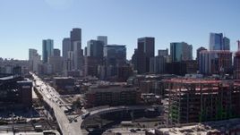 5.7K aerial stock footage of skyline seen while descending in Downtown Denver, Colorado Aerial Stock Footage | DX0001_001482