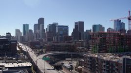 5.7K aerial stock footage reveal the city skyline while ascending in Downtown Denver, Colorado Aerial Stock Footage | DX0001_001483