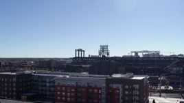 5.7K aerial stock footage ascend by apartment buildings to reveal Coors Field baseball stadium, Downtown Denver, Colorado Aerial Stock Footage | DX0001_001488