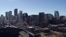 5.7K aerial stock footage of the city skyline seen from stadium in Downtown Denver, Colorado Aerial Stock Footage | DX0001_001493