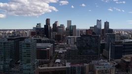 5.7K aerial stock footage of the city's skyline seen while flying by office buildings in Downtown Denver, Colorado Aerial Stock Footage | DX0001_001496
