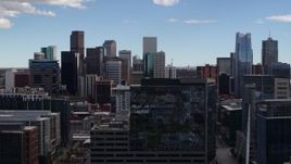 5.7K aerial stock footage of the city's skyline seen while descending near office buildings in Downtown Denver, Colorado Aerial Stock Footage | DX0001_001506