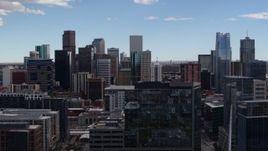 5.7K aerial stock footage of the city's skyline seen while ascending near office buildings in Downtown Denver, Colorado Aerial Stock Footage | DX0001_001507