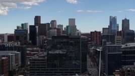 5.7K aerial stock footage of the city's skyline seen while ascending over an office building in Downtown Denver, Colorado Aerial Stock Footage | DX0001_001508