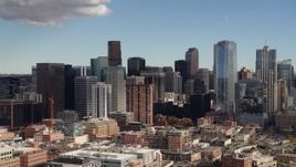 5.7K aerial stock footage of flying by towering skyscrapers of the city skyline in Downtown Denver, Colorado Aerial Stock Footage | DX0001_001524