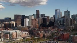 5.7K aerial stock footage of a reverse and side view of towering skyscrapers of the city skyline, Downtown Denver, Colorado Aerial Stock Footage | DX0001_001530