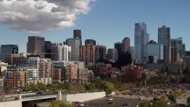 5.7K aerial stock footage of towering skyscrapers of the city skyline seen during descent, Downtown Denver, Colorado Aerial Stock Footage | DX0001_001531