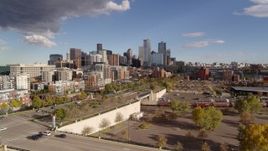 5.7K aerial stock footage of the city skyline in the distance seen while descending, Downtown Denver, Colorado Aerial Stock Footage | DX0001_001542