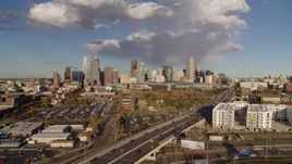 5.7K aerial stock footage of the city skyline seen while ascending by W Colfax Avenue, Downtown Denver, Colorado Aerial Stock Footage | DX0001_001544