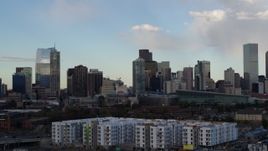 5.7K aerial stock footage of tall skyscrapers in the city skyline with clouds in the sky, Downtown Denver, Colorado Aerial Stock Footage | DX0001_001552