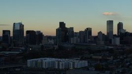 5.7K aerial stock footage stationary view of skyscrapers in the city skyline at sunset, Downtown Denver, Colorado Aerial Stock Footage | DX0001_001561
