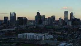 5.7K aerial stock footage stationary view of the city's skyline at sunset before descent, Downtown Denver, Colorado Aerial Stock Footage | DX0001_001563