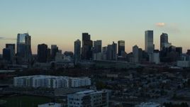 5.7K aerial stock footage of slowly flying by the city's skyline at sunset, Downtown Denver, Colorado Aerial Stock Footage | DX0001_001564