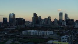 5.7K aerial stock footage of a reverse view of the city's skyline at sunset, Downtown Denver, Colorado Aerial Stock Footage | DX0001_001567