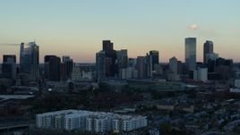 5.7K aerial stock footage fly away from the city's skyline at sunset before descent, Downtown Denver, Colorado Aerial Stock Footage | DX0001_001571