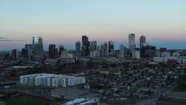 5.7K aerial stock footage ascend for a view of the city's downtown skyline at sunset, Downtown Denver, Colorado Aerial Stock Footage | DX0001_001575