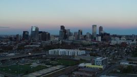 5.7K aerial stock footage of a slow approach to the city's downtown skyline at sunset, Downtown Denver, Colorado Aerial Stock Footage | DX0001_001577