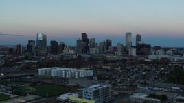 5.7K aerial stock footage of a stationary view and flyby of the city's downtown skyline at sunset, Downtown Denver, Colorado Aerial Stock Footage | DX0001_001580