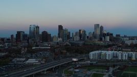 5.7K aerial stock footage flyby the city's downtown skyline at sunset, seen while descending, Downtown Denver, Colorado Aerial Stock Footage | DX0001_001582