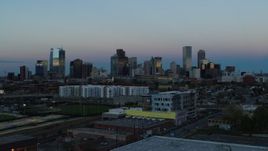 5.7K aerial stock footage descend near baseball field with view of the city's downtown skyline at sunset, Downtown Denver, Colorado Aerial Stock Footage | DX0001_001585