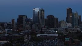 5.7K aerial stock footage of flying by skyscrapers and hotel high-rise at twilight, Downtown Denver, Colorado Aerial Stock Footage | DX0001_001587