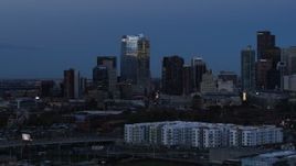 5.7K aerial stock footage of flyby skyscrapers and hotel high-rise at twilight, Downtown Denver, Colorado Aerial Stock Footage | DX0001_001588