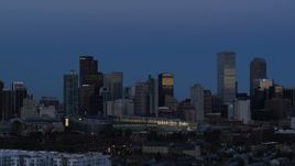 5.7K aerial stock footage of flying by the city's downtown skyscrapers by convention center at twilight, Downtown Denver, Colorado Aerial Stock Footage | DX0001_001589