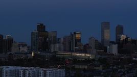 5.7K aerial stock footage of the city's skyscrapers by convention center at twilight, then descend, Downtown Denver, Colorado Aerial Stock Footage | DX0001_001593