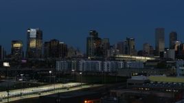 5.7K aerial stock footage flyby and stationary view of the city's skyscrapers at twilight, Downtown Denver, Colorado Aerial Stock Footage | DX0001_001594