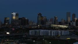 5.7K aerial stock footage flyby the city's skyscrapers at twilight while ascending, Downtown Denver, Colorado Aerial Stock Footage | DX0001_001595