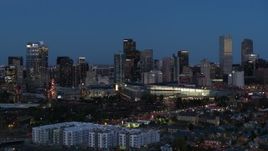 5.7K aerial stock footage passing the city's skyscrapers and convention center at twilight, Downtown Denver, Colorado Aerial Stock Footage | DX0001_001598