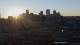 5.7K aerial stock footage flyby skyscraper for view of city skyline at sunrise in Downtown Denver, Colorado Aerial Stock Footage | DX0001_001617