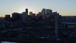 5.7K aerial stock footage flyby rising sun and city skyline at sunrise in Downtown Denver, Colorado Aerial Stock Footage | DX0001_001618
