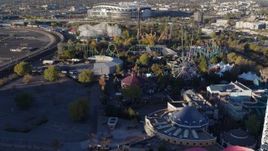 5.7K aerial stock footage fly over rides at Elitch Gardens at sunrise in Downtown Denver, Colorado Aerial Stock Footage | DX0001_001634