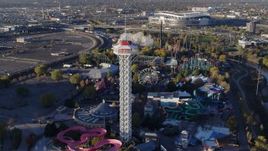 5.7K aerial stock footage of flying by rides at Elitch Gardens at sunrise in Downtown Denver, Colorado Aerial Stock Footage | DX0001_001636