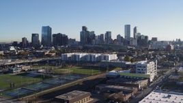5.7K aerial stock footage ascend for a stationary view of city skyline at sunrise in Downtown Denver, Colorado Aerial Stock Footage | DX0001_001637