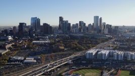 5.7K aerial stock footage flying by the city skyline at sunrise in Downtown Denver, Colorado Aerial Stock Footage | DX0001_001639