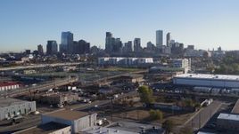 5.7K aerial stock footage of a stationary view of the city skyline at sunrise in Downtown Denver, Colorado Aerial Stock Footage | DX0001_001641