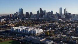 5.7K aerial stock footage ascend to reveal the city skyline at sunrise in Downtown Denver, Colorado Aerial Stock Footage | DX0001_001644