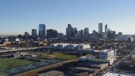 5.7K aerial stock footage reverse view of the city skyline at sunrise before descent in Downtown Denver, Colorado Aerial Stock Footage | DX0001_001645