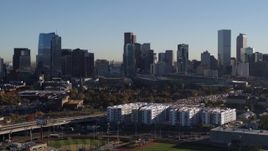 5.7K aerial stock footage of flying by the city's skyline at sunrise in Downtown Denver, Colorado Aerial Stock Footage | DX0001_001647