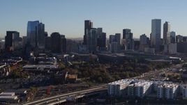 5.7K aerial stock footage of towering skyscrapers in the city's skyline at sunrise in Downtown Denver, Colorado Aerial Stock Footage | DX0001_001653