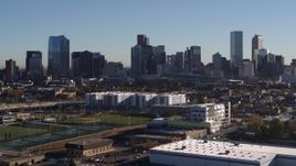 5.7K aerial stock footage flyby and ascend the city's skyline at sunrise in Downtown Denver, Colorado Aerial Stock Footage | DX0001_001655